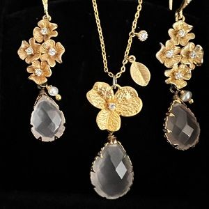 Gold flower earrings and pendant, matching set.